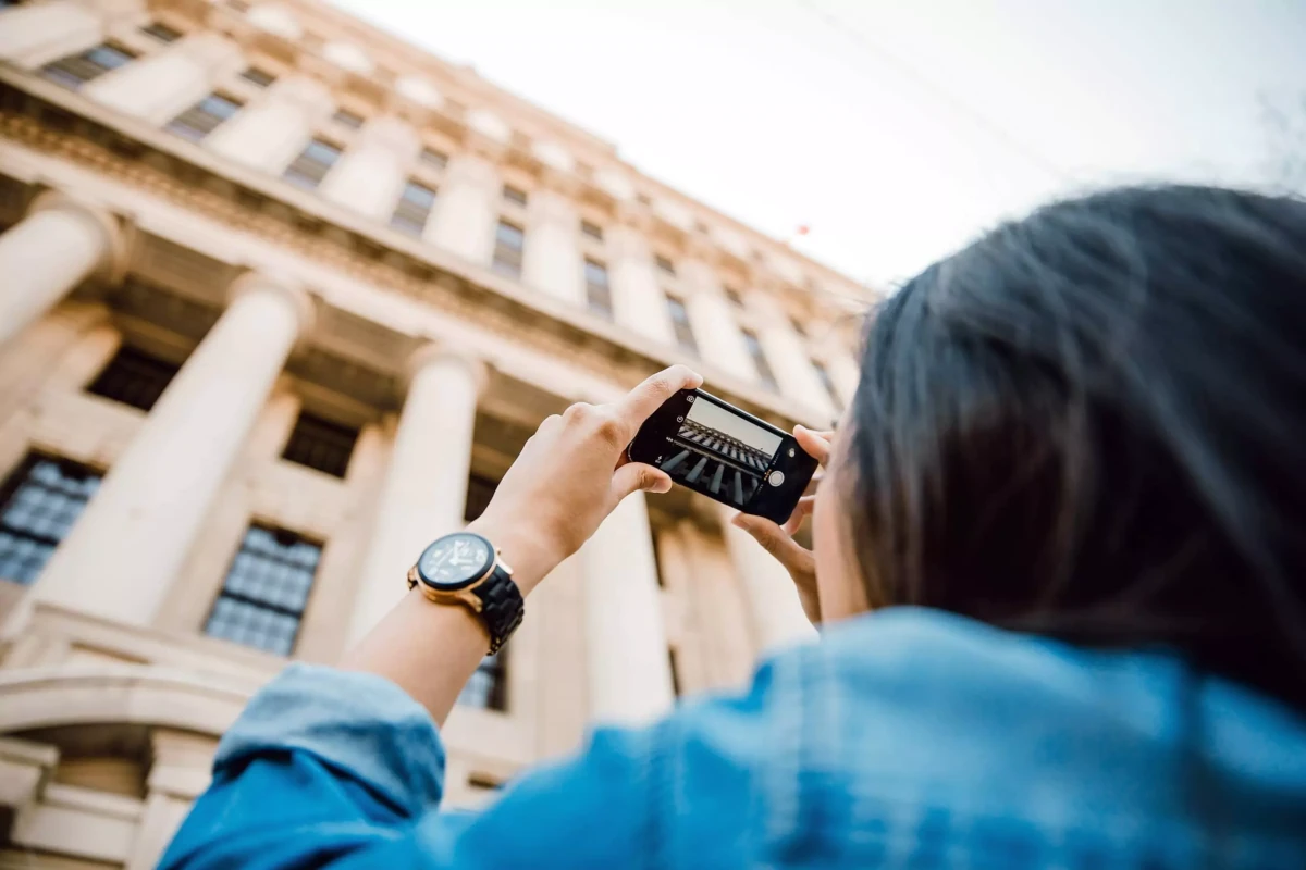 Home Tourist taking photo of a building